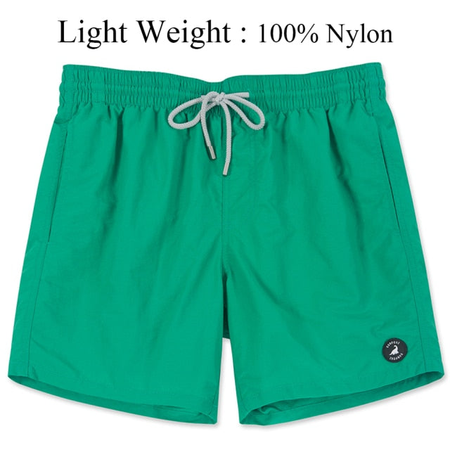 Men's Swimming Shorts with Pockets and Mesh Lining Quick Dry Solid Beach Board